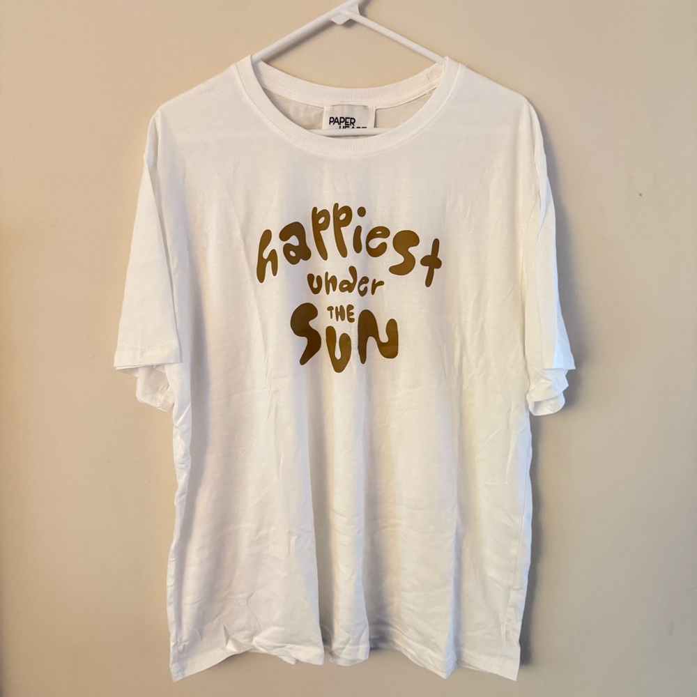 White XL T-Shirt that says “Happiest Under the Sun”